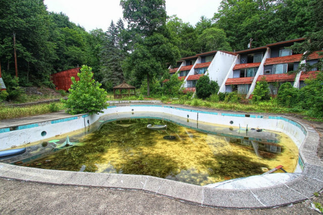 View of the Penn Hills Resort pool, shaped like a wedding bell, suffering neglect after the resort was abandoned. August, 2012. Source