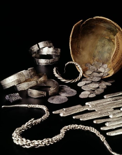 A hoard of 1,000-year-old artefacts including more than 200 coins, ingots pieces of silver jewellery, found buried in north Lancashire. The British Museum are examining the hoard after it was discovered in a lead pot by a metal detector enthusiast. The hoard buried at a time when the Anglo-Saxons were attempting to take control of the north of England from the Vikings. source