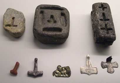 Viking Age molds for making silver pendants--Crucifixes & Mjolnir (Thor's Hammer). The far right mold could be used for making either depending on the customer. Mjolnir pendants only became popular to compete with the crosses worn by those with the new religion at the spread of Christianity. source