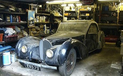 1937 Bugatti Type 57S number 57502 pictured in the garage where it was discovered (undated photograph released by Bonhams) source