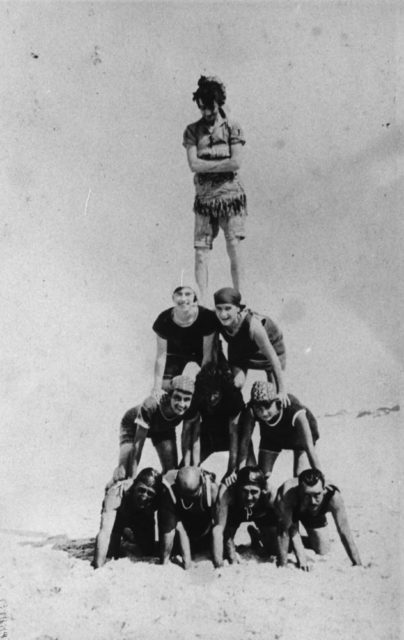 Human tower on the sands at South Stradbroke Island, 1922 Young people from Roe's Camp playing games on the beach. . source