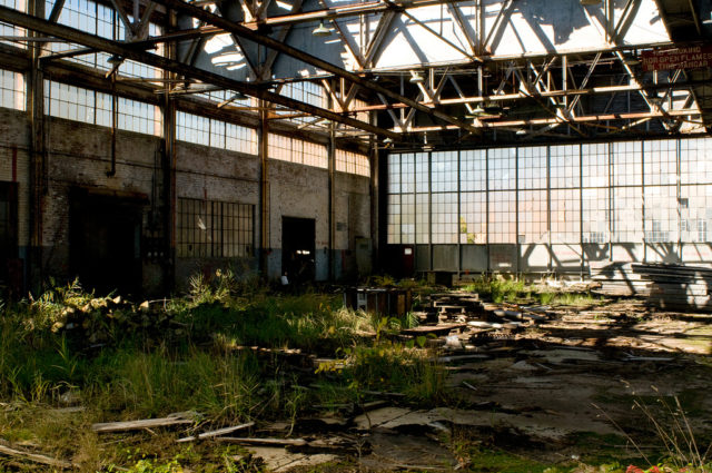 Inside an abandoned hangar. source Listen Missy/Flickr