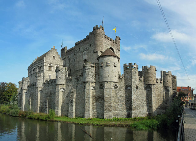 A view of Gravensteen Castle, demonstrating its picturesque moat. Source