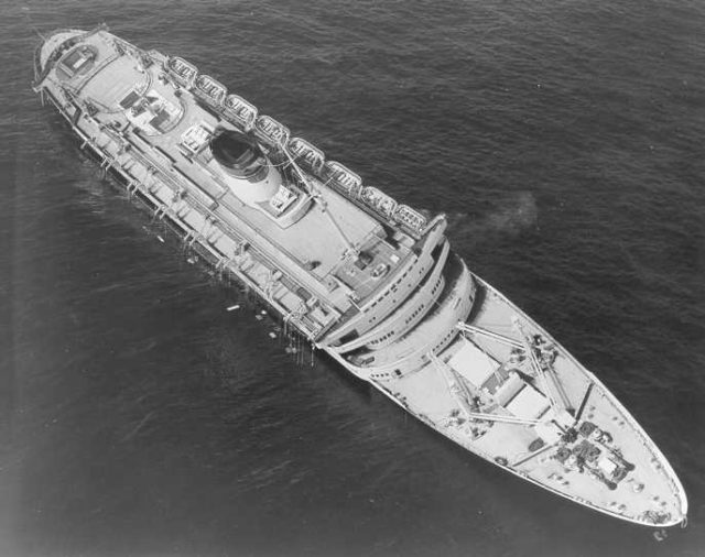 Andrea Doria awaiting its impending fate the morning after the collision in the Atlantic Ocean, July 26, 1956 Source