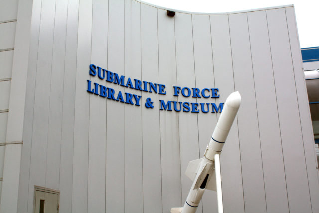 Main entrance sign with a UGM-84 Harpoon anti-ship missile. Source