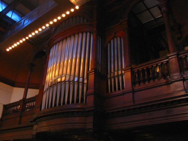 The pipes of the pipe organ in the art gallery. Source