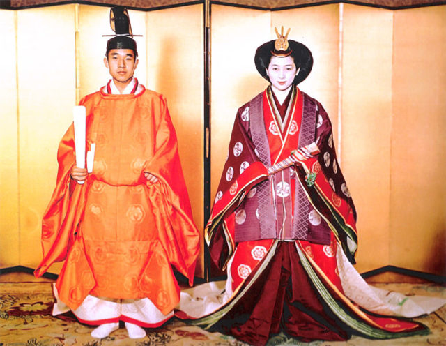 The newly married Crown Prince and Crown Princess in Japanese traditional attire, with the Prince wearing a sokutai, the Princess a jūnihitoe