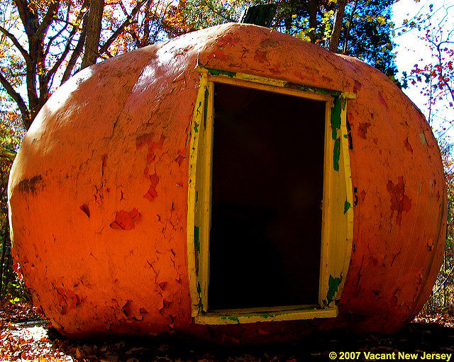 A giant fiber-glass pumpkin, now faded to lught orange through years of neglect. Source