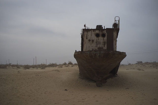 A graveyard of ships, lying in the sands where the waters once flowed. Source