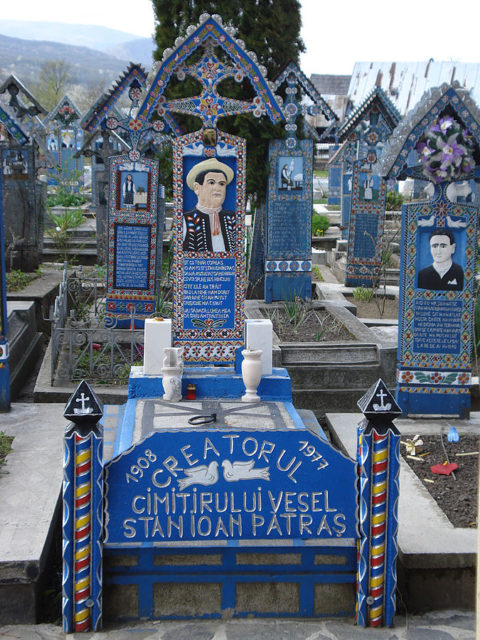 Stan Ioan Pătraş carved the crosses until his death in 1977. His tombstone at the Merry Cemetery. Source