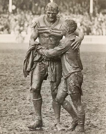 The Gladiators, John O'Gready's famous photograph of the two opposing captains, Norm Provan and Arthur Summons, taken after the match. - Copy