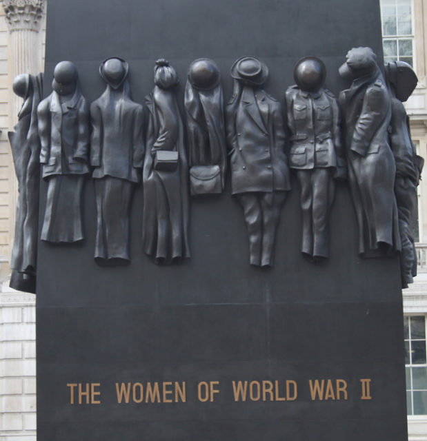 The sides of the block are sculpted with 17 individual sets of clothing and uniforms worn by women during the war. Source