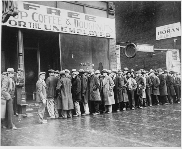 Unemployed men queued outside a depression soup kitchen opened in Chicago by Al Capone, 1931. Source