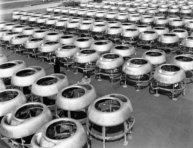 A tarmac full of B-29 engine nacelle caps being inspected