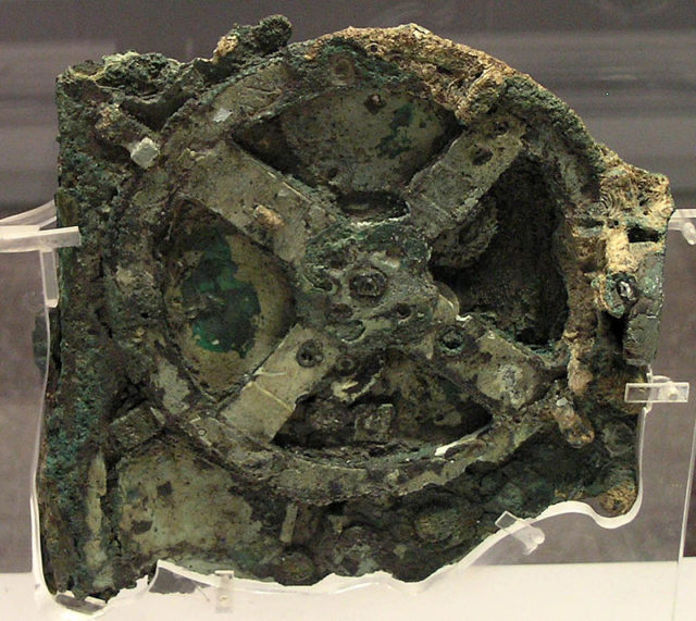 The Antikythera mechanism (Fragment A – front) Source:By No machine-readable author provided. Marsyas assumed (based on copyright claims). - No machine-readable source provided. Own work assumed (based on copyright claims)., CC BY 2.5, 