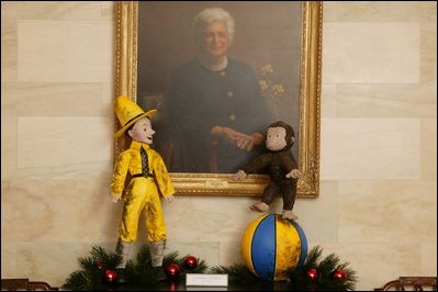 The White House 2003 Christmas decoration using Curious George as the theme with the Barbara Bush portrait.