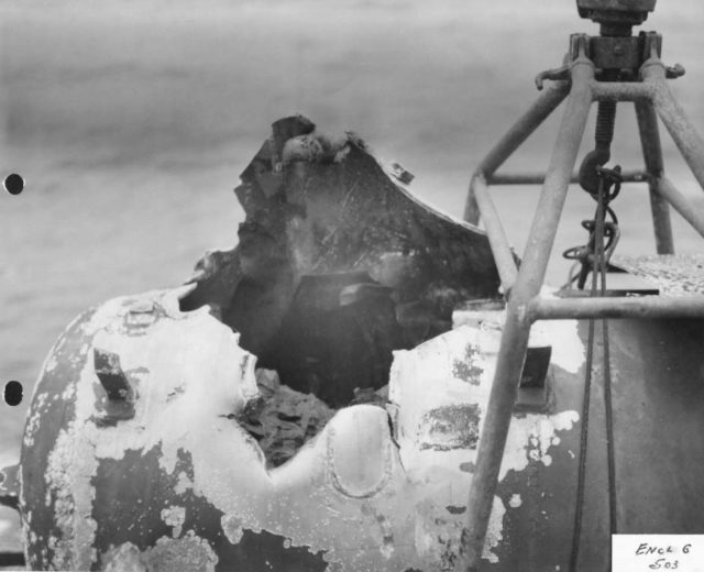 Damaged torpedo and case in cradle on U-505