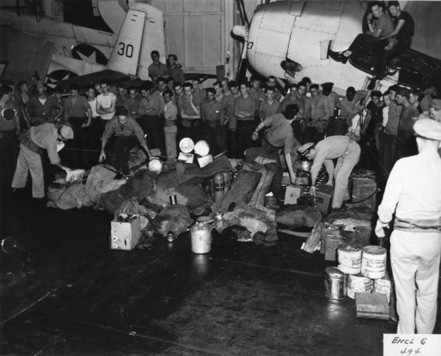 Gear stacked on the hangar deck that was brought over from the sub.