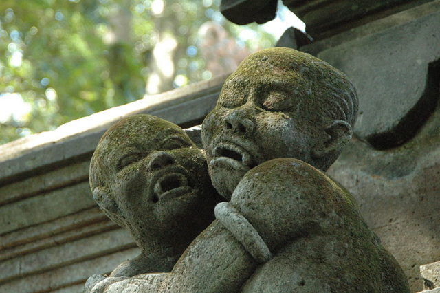 Statue of a vampire-like creature near the temple in Ubud, Bali. Photo credit