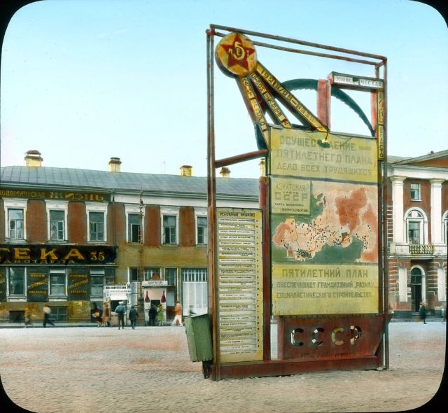 Propaganda stand dedicated to the first five-year plan in Moscow. 1931 colour photo by Branson DeCou.