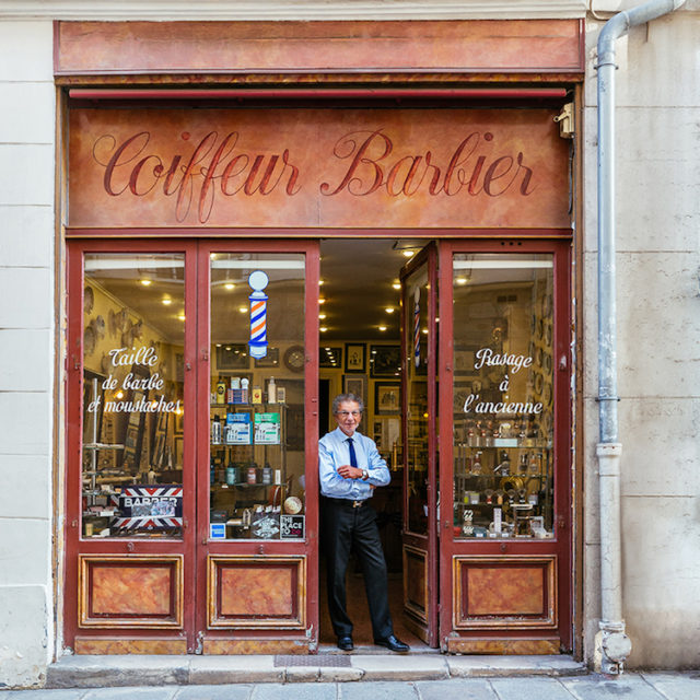 Alain at the door of his barber shop the most famous in paris