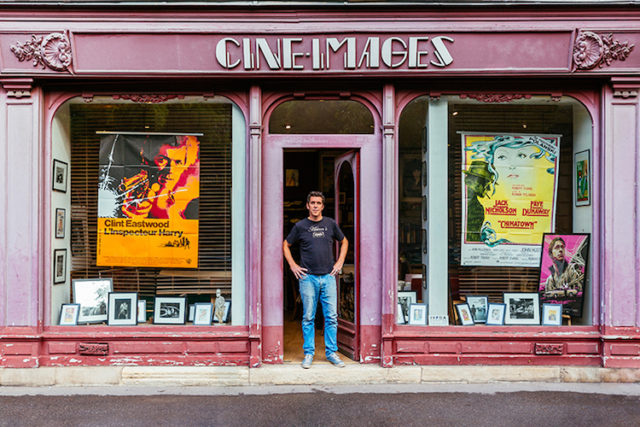 Alexandre boyer surrounded by pictures and posters from the history of cinema