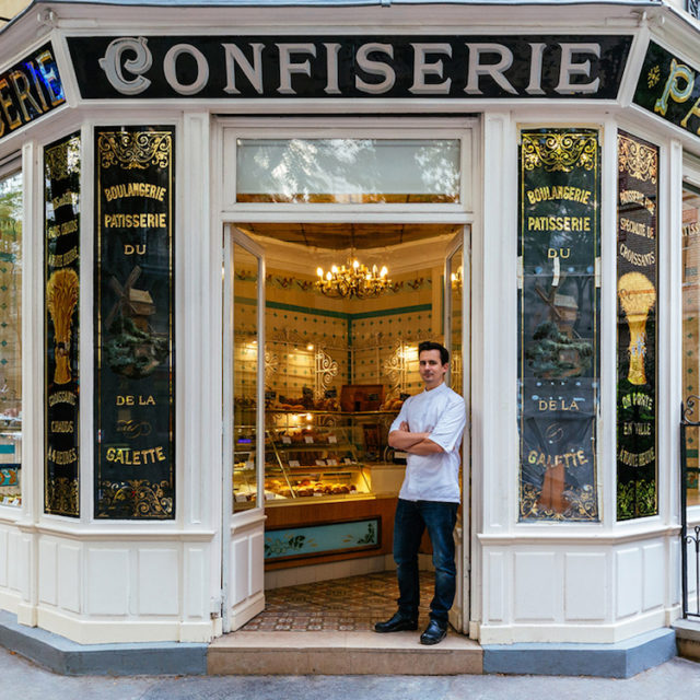 Boris Lumé, standing proudly at the entrance of his picturesque bakery-confectionery