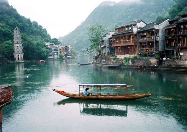 Fenghuang City is renowned for its splendid Miao culture, especially the Miao-style stilted houses. Photo Ctedit