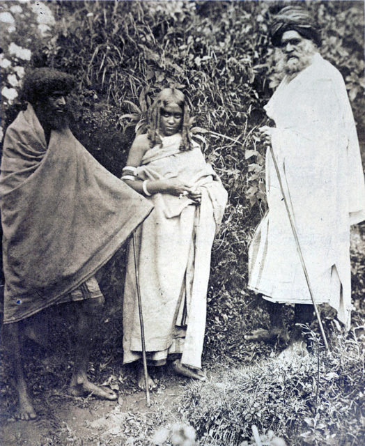 Photograph of two Toda men and a woman. Nilgiri Hills, 1871.