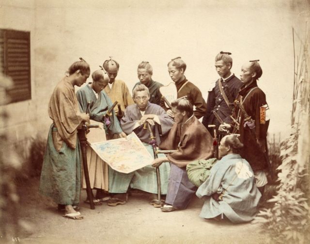 Samurai of the Satsuma clan, during the Boshin War period, circa 1867. Hand-colored Photograph by Felice Beato