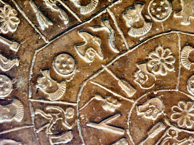 The inscription was apparently made by pressing pre-formed hieroglyphic seals into the soft clay, in a clockwise sequence spiraling toward the center of the disk. Photo Credit 