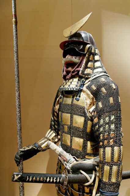 Edo period karuta tatami dō gusoku. A lightweight portable folding (tatami) armour made from small square or rectangle armor plates called karuta. The karuta are usually connected to each other by chainmail and sewn to a cloth backing, Met Museum New York.
