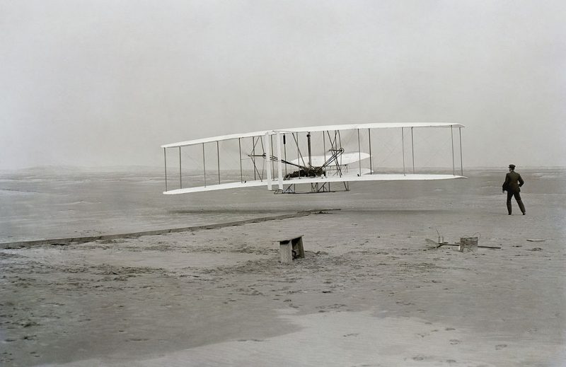 The Wright Flyer: the first sustained flight with a powered, controlled aircraft.