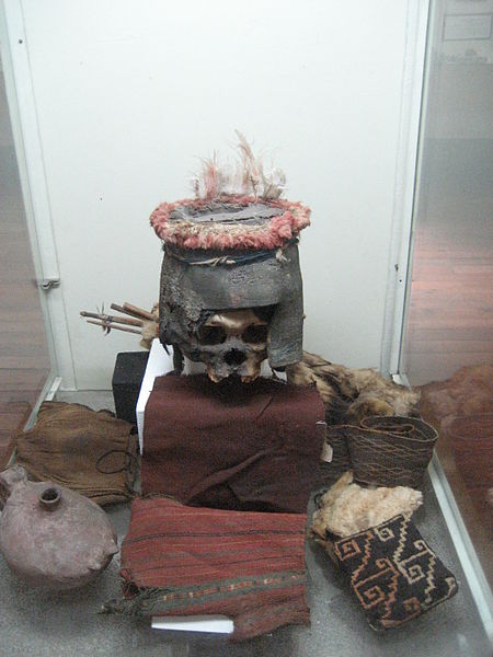 Chinchorro funeral rites Human skull with funeral helmet and various items. Displayed at Anker Nielsen museum in Chile.