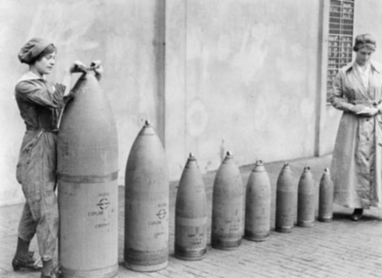 Some of the deadly shells developed and used in the First World War lined up by women factory workers