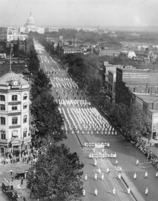 In the 1920s Americans were growing progressively more xenophobic because of the burden of their involvement in WWI. Klan members parade down Pennsylvania Avenue
