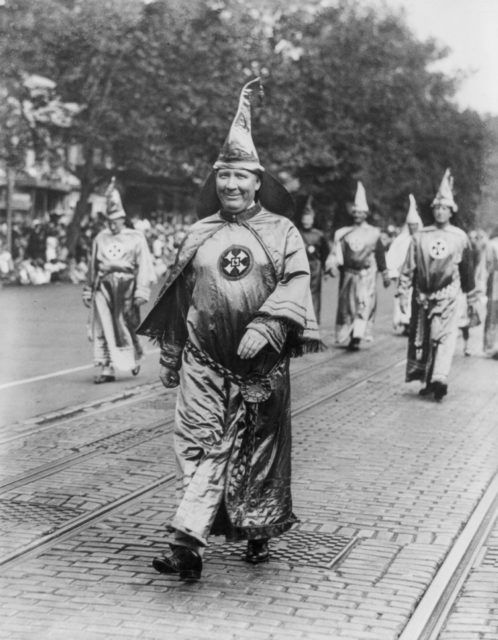 Dr. H.W. Evans, Imperial Wizard of the Ku Klux Klan, walks in the parade. 