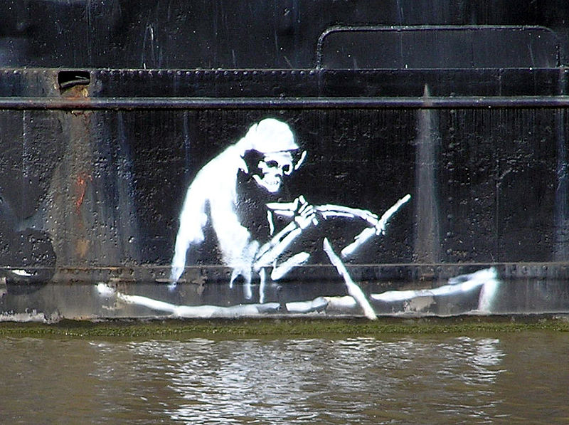 Stencil by Banksy on the waterline of The Thekla, an entertainment boat in central Bristol