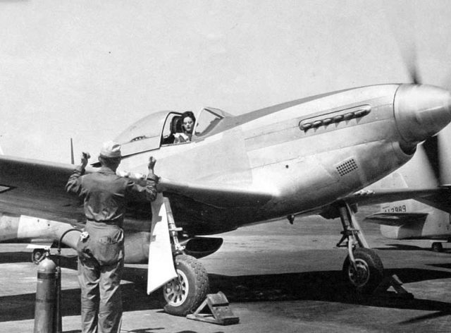 Florene Watson preparing a P-51D-5NA for a ferry flight from the factory at Inglewood, California