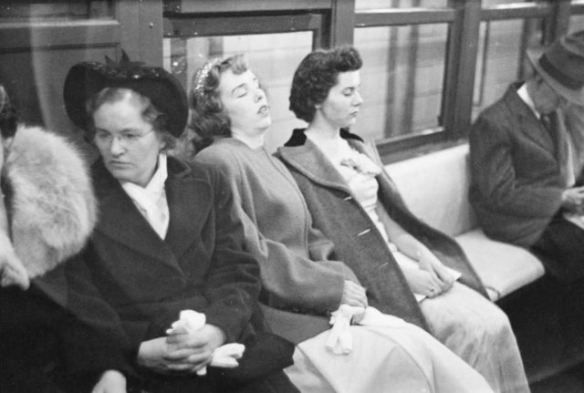 Woman sleeping in a subway Photo Credit