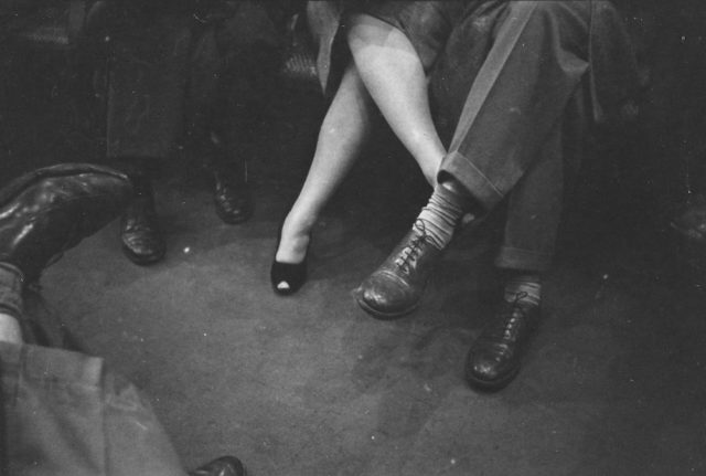 Couple playing footsies on a subway. 1946. Phpto Credit
