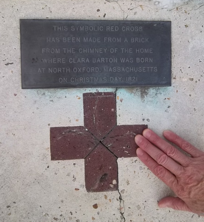 Detail of Clara Barton monument at Antietam National Battlefield, with red cross formed of a brick from the home where she was born. Photo Credit