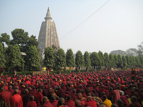 Monks participating in prayer at Mahabodhi Temple. Photo Credit