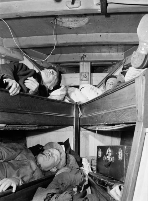 Glouchester fishermen resting in their bunks after unloading their catch at the Fulton fish market Photo Credit