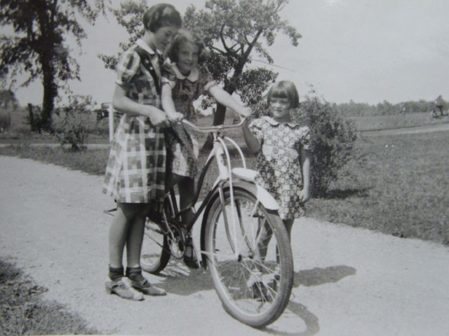 Girls learning to ride a bike in the 1930s Photo Credit