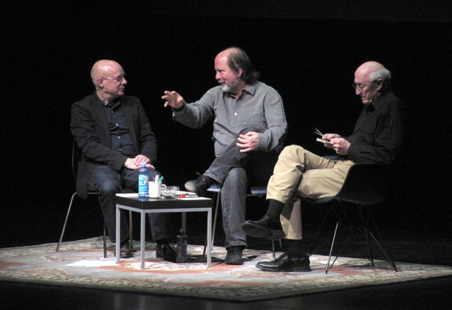 Brian Eno, Danny Hillis, and Stewart Brand speaking at "The Long Now, now" – an event in January 2014 at the Palace of Fine Arts in San Francisco. Photo Credit