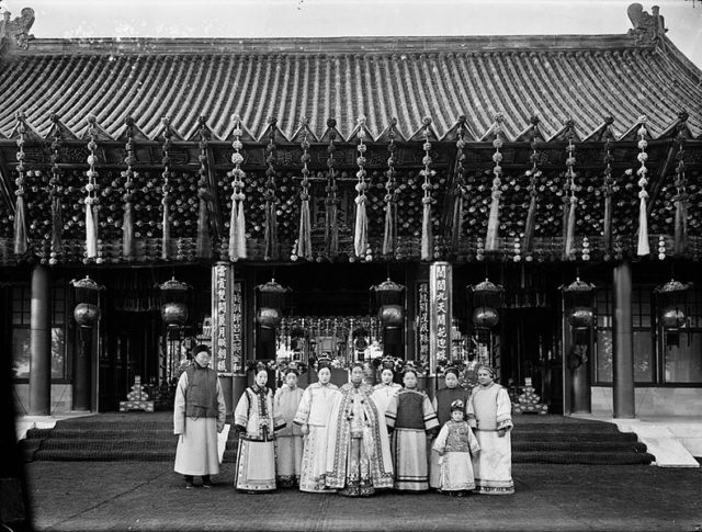 Empress Dowager Cixi (front middle) poses with her court attendants and the Guangxu Emperor's empress (second from left), who was also her niece.