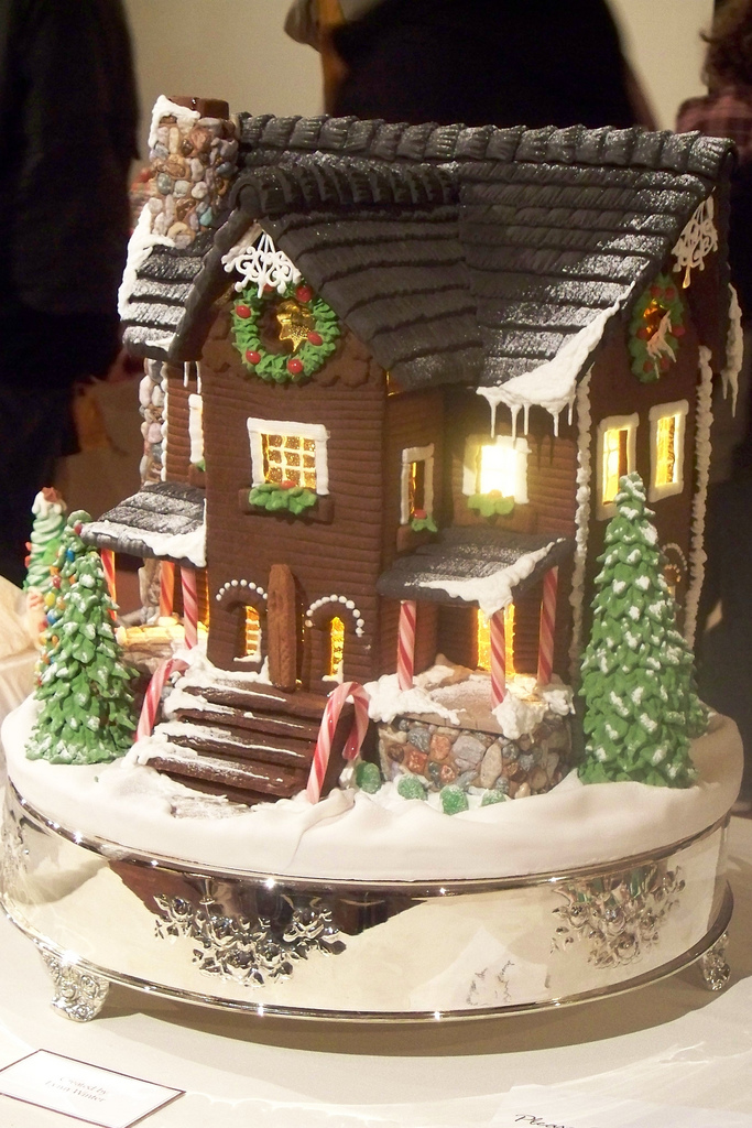 Gingerbread house with steps and trees. Photo Credit