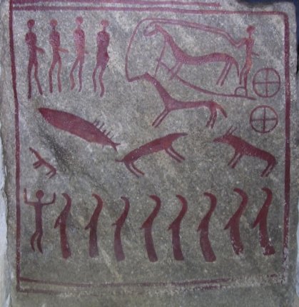 One of ten slabs of stone shows a horse drawn chariot with two four-spoked wheels. Photo Credit