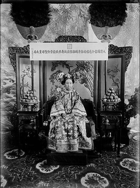 The plaque hanging above Cixi is inscribed with her title in full.